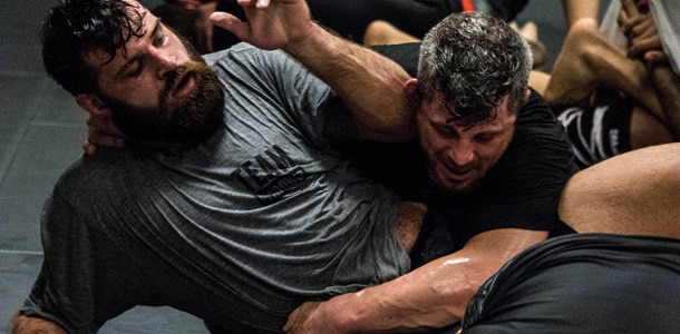 Two men sparring in an adult jiu-jitsu class