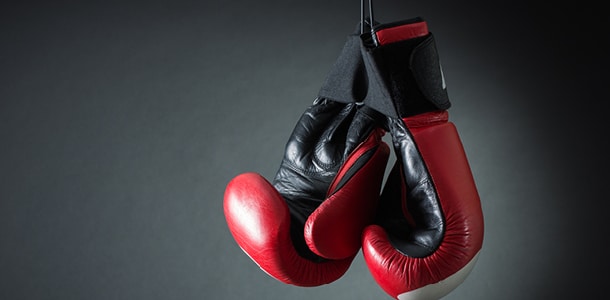 A pair of boxing gloves hanging up