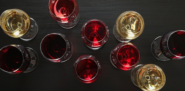 Birds-eye view of glasses of white and red wine