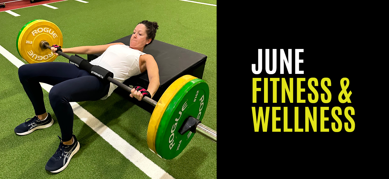 Woman doing a hip press with a weighted barbell