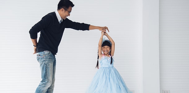 A father and his young daughter dancing at a Daddy & Daughter dance