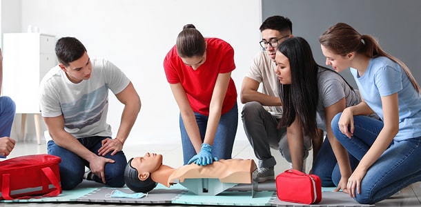 A group of people in a CPR Instruction class