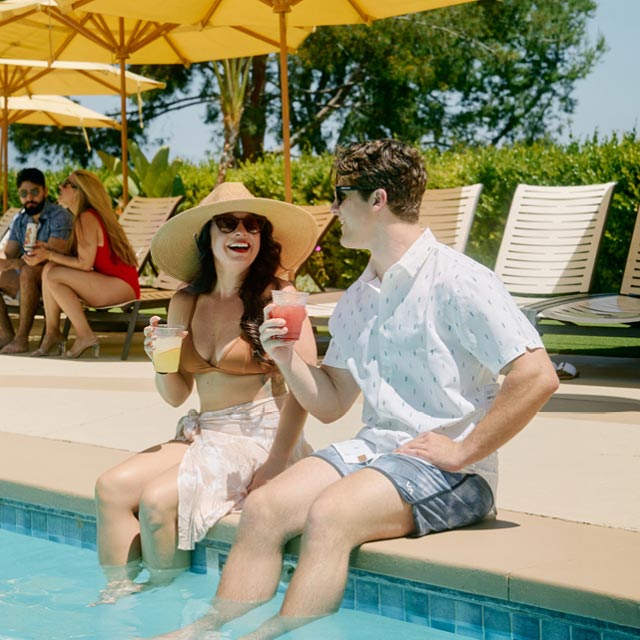 Two ClubSport members enjoying the resort pool and aquatics center