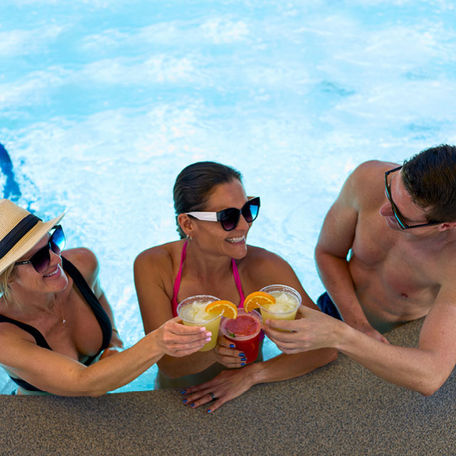 A group of friends enjoying the outdoor hot tub jacuzzi
