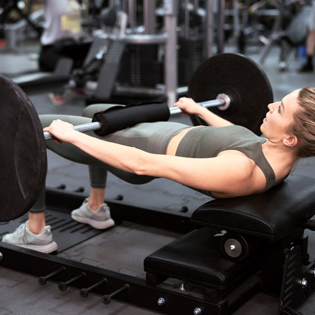 a woman doing Olympic weight lifting exercises on the premier fitness floor